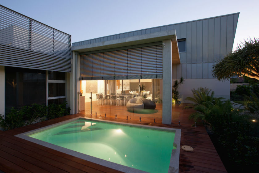 Undercover patio features weather controlled blinds.