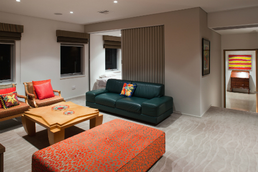 This guest retreat is decorated in tones of emerald green and bright red.